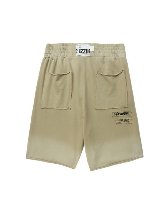 IZZUE - Spray distress shorts beige - BACKSTAGE - باك ستيج - BACKSTAGE باك ستيج your go-to destination for discovering the finest brands that cater to every taste and occasion in KSA and Middle East.