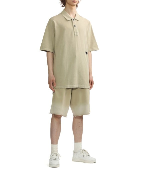IZZUE - Spray distress shorts beige - BACKSTAGE - باك ستيج - BACKSTAGE باك ستيج your go-to destination for discovering the finest brands that cater to every taste and occasion in KSA and Middle East.